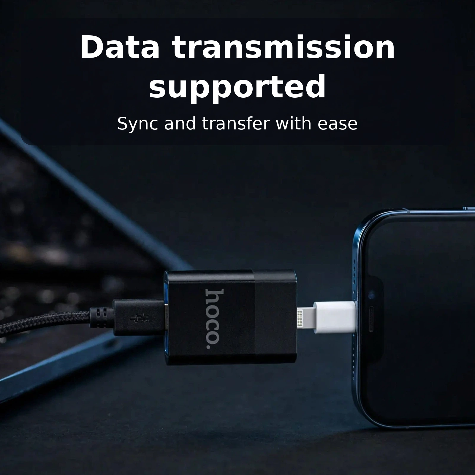 Hoco UA17 Lightning to USB adapter connecting an iPhone to a laptop through a USB cable for data transmission