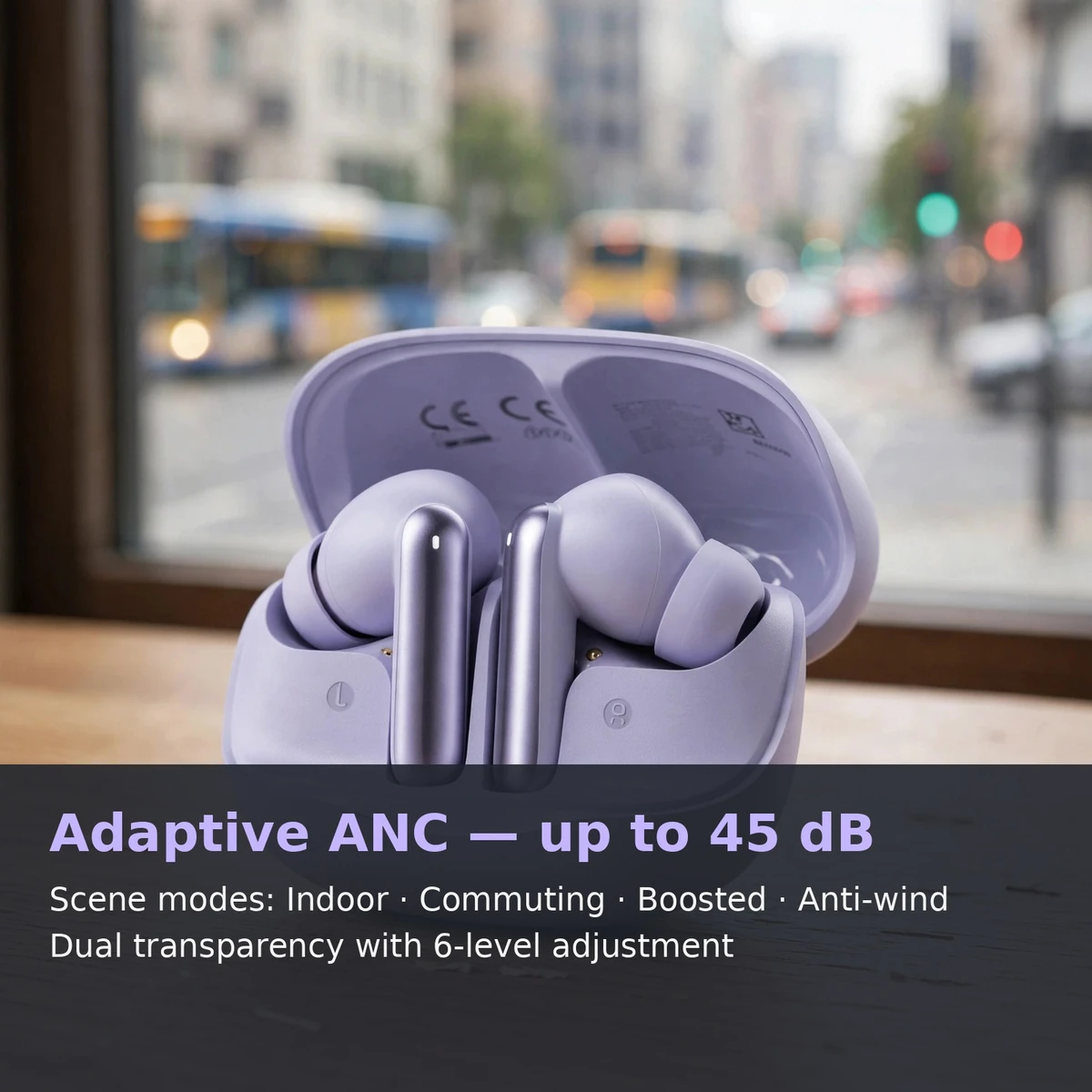Feature card: QCY MeloBuds N50 open case on a desk with blurred city traffic behind it, text overlay on adaptive ANC up to 45 dB