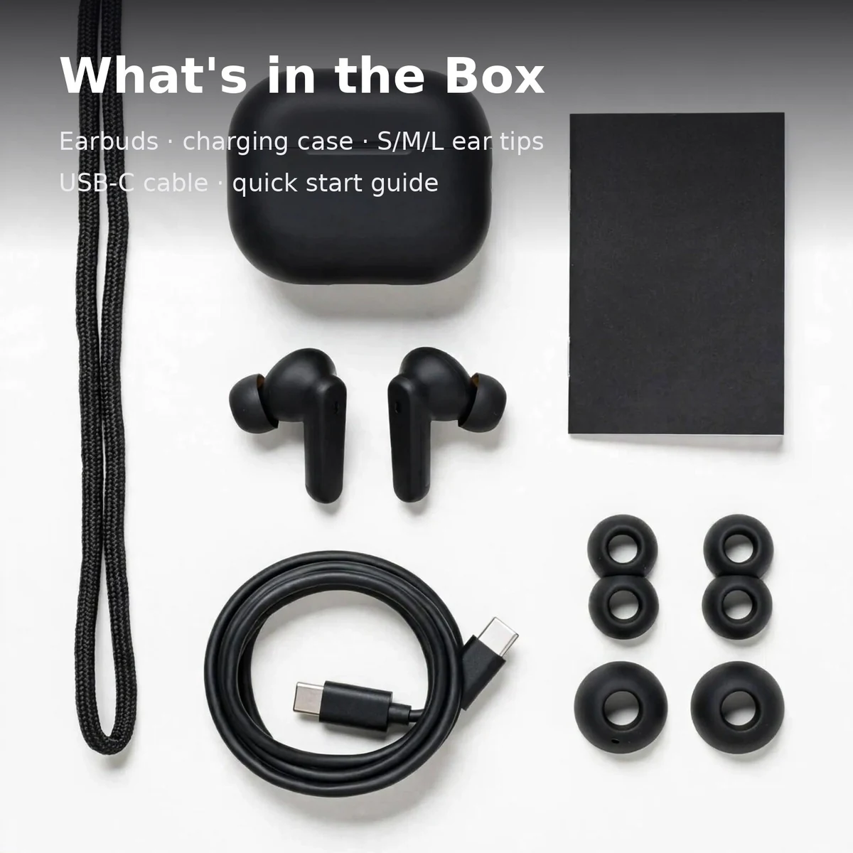 Anker Soundcore R50i box contents flat lay: earbuds, charging case, ear tips, USB-C cable, quick start guide