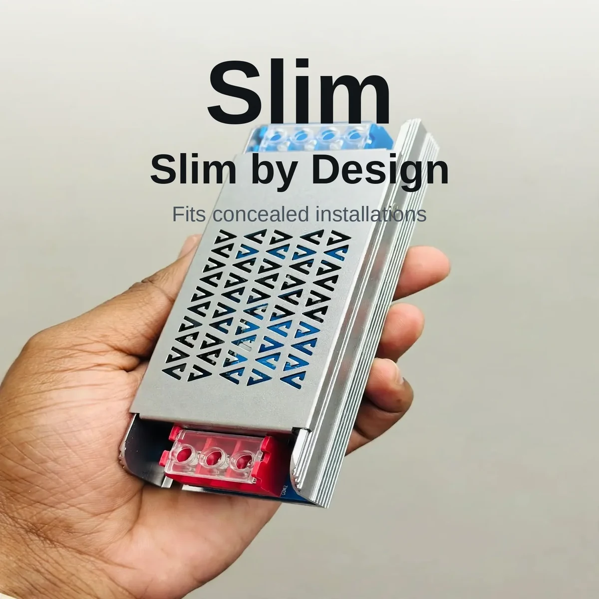 Hand holding the slim GearUP 100W driver showing its compact profile