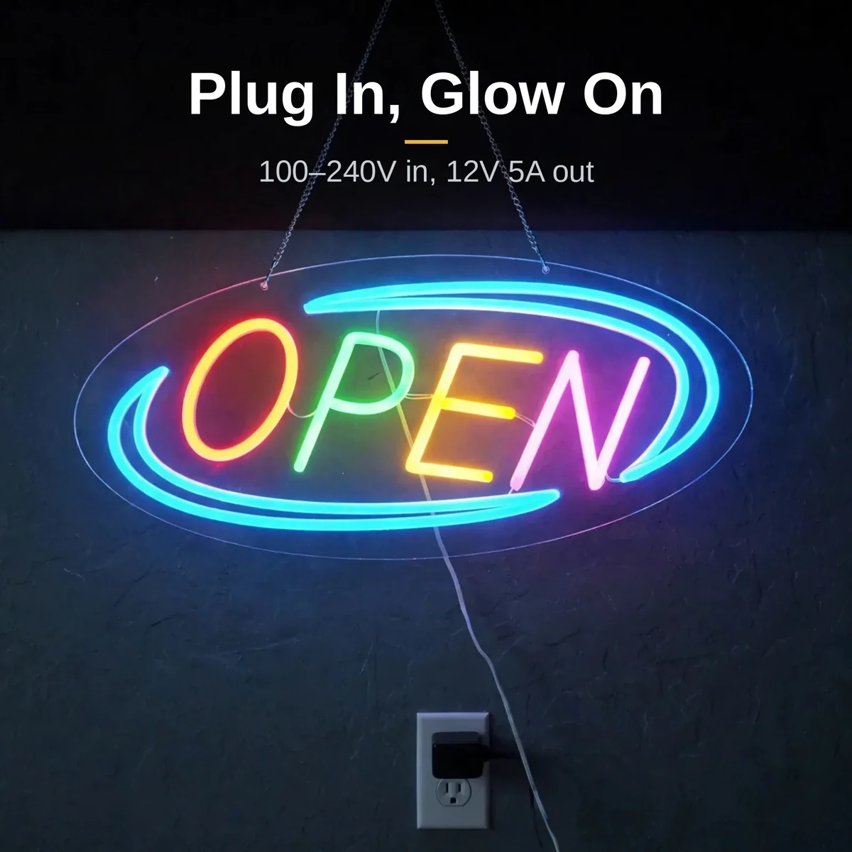 GearUP OPEN20R neon sign glowing while plugged into a wall outlet at dusk