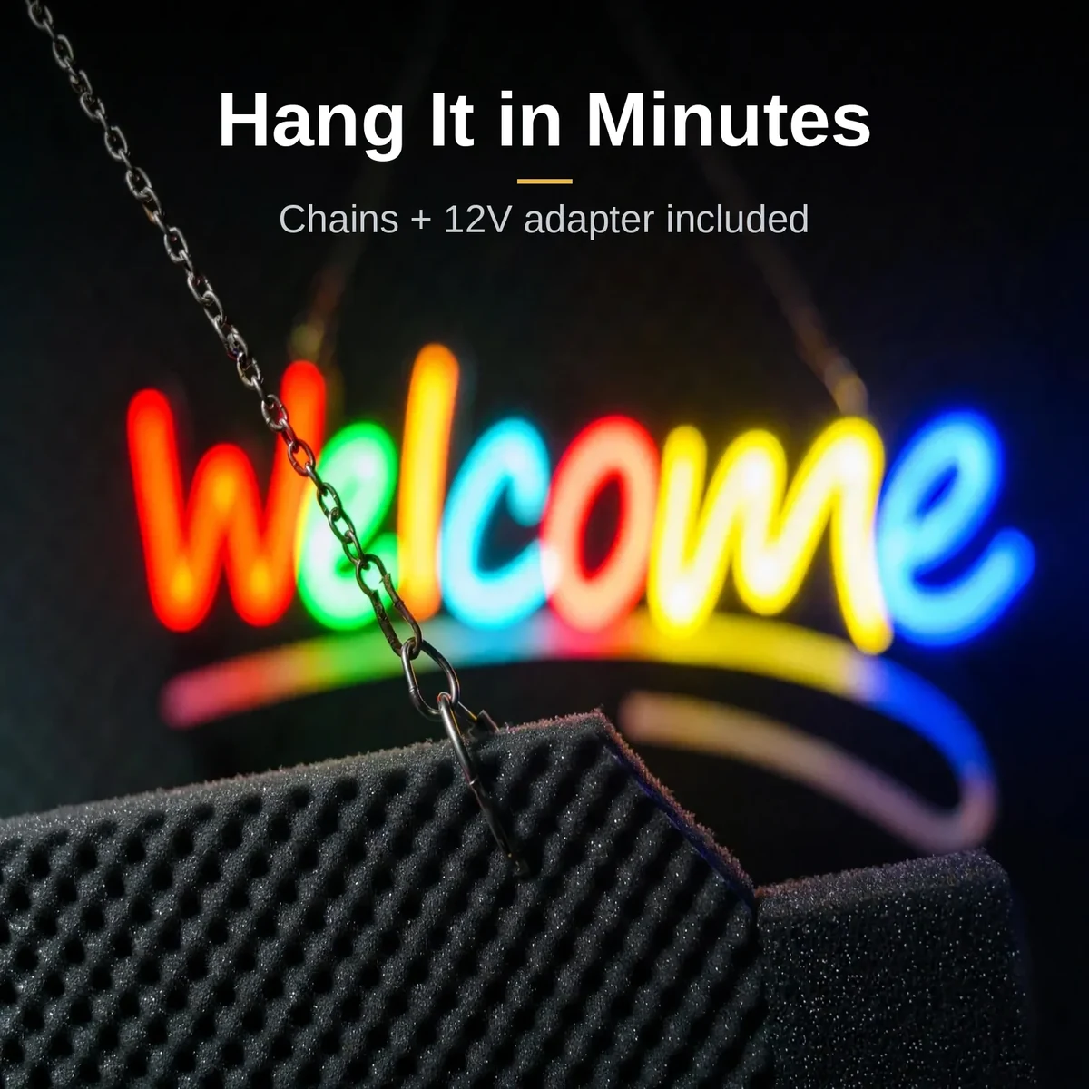 Close-up of the GearUP WELCOME neon sign hanging chain and dark backing edge