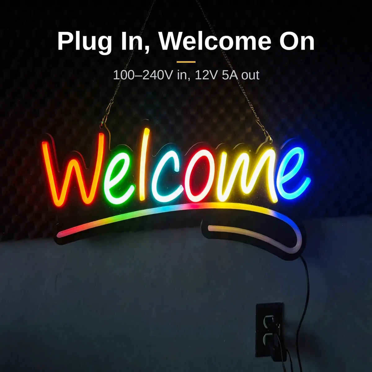 GearUP WELCOME neon sign glowing while plugged into a wall outlet