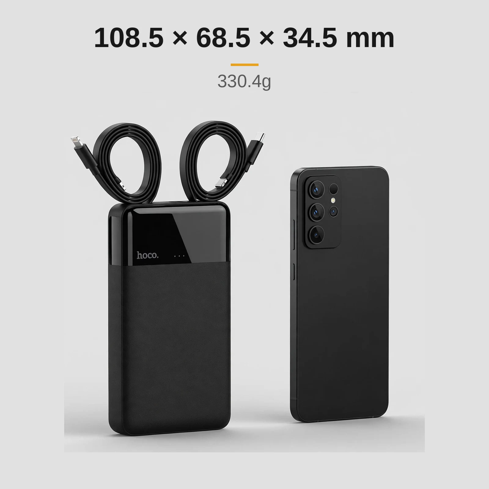 Hoco DYM12 size comparison beside a smartphone: 108.5 x 68.5 x 34.5 mm, 330.4g