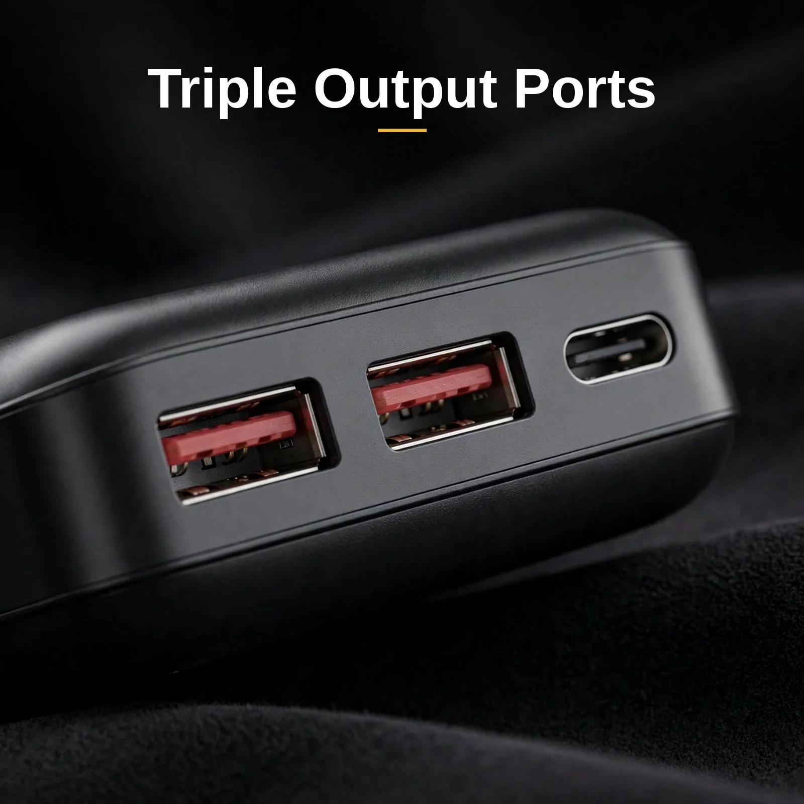 Close-up of the Hoco J101A triple output ports: two USB-A ports with red tongues and one Type-C port