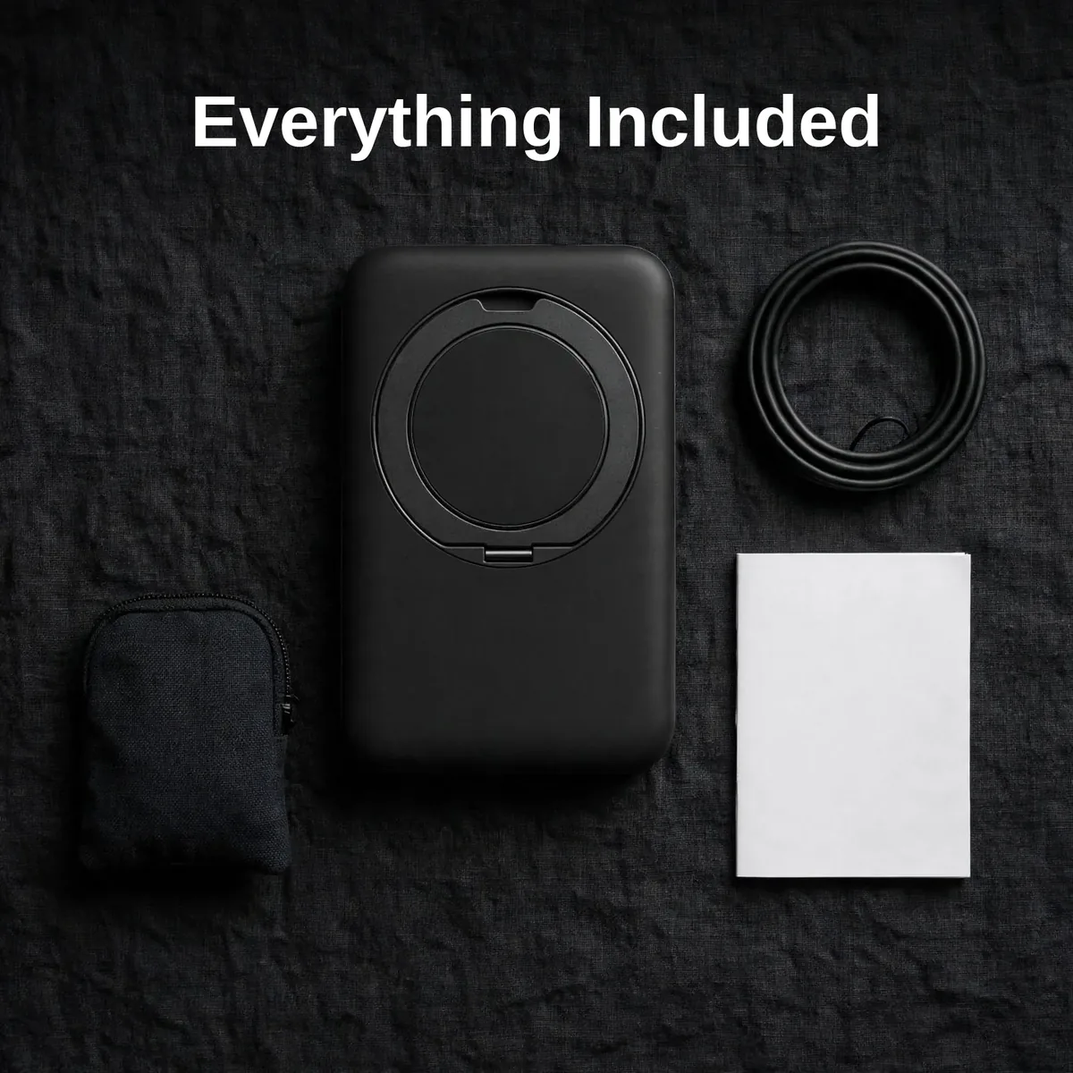 Everything included with the Joyroom JR-PBM12: the power bank, a cable, a storage bag and the user manual