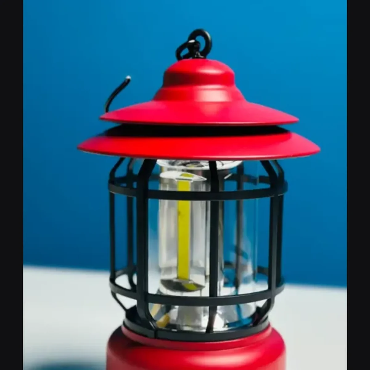 Detail view of the L-27 camping lamp hood, cage, and glass design