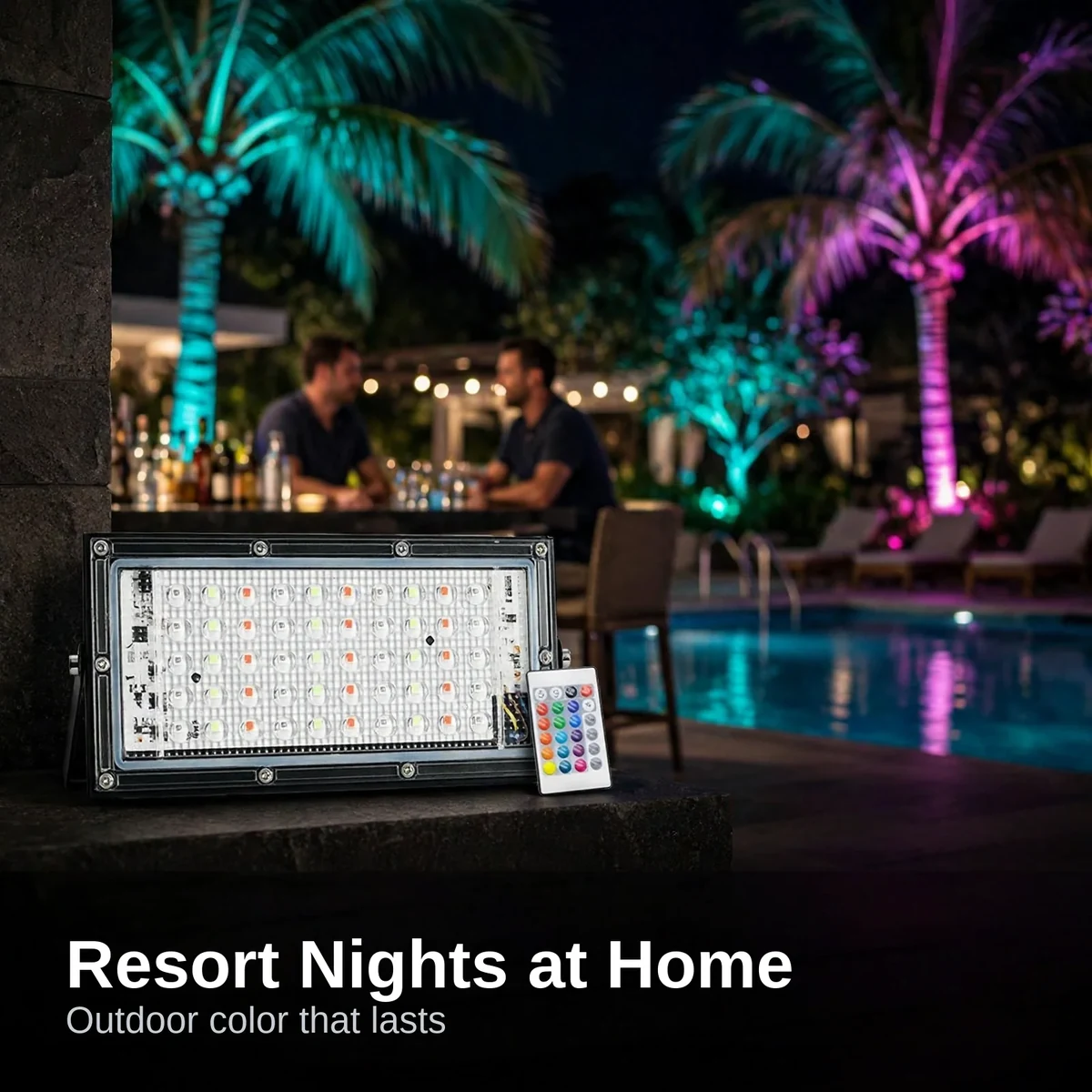 LED flood light 50W coloring palm trees at a resort-style pool deck at night