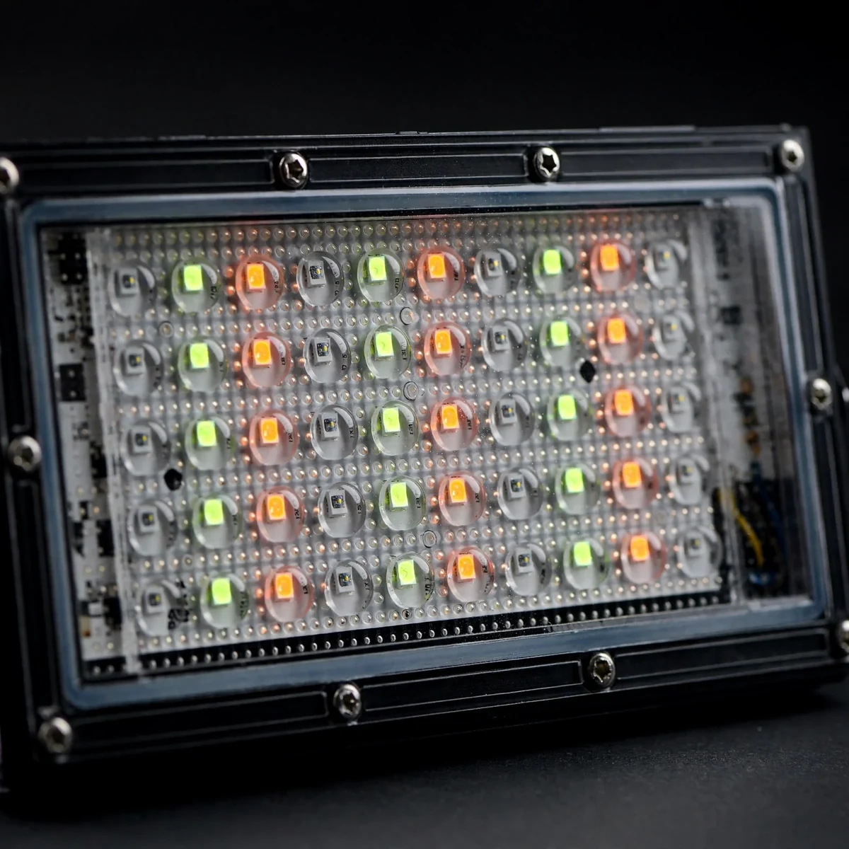 Close-up of the multicolor LED bead grid behind the glass front of the LED flood light 50W