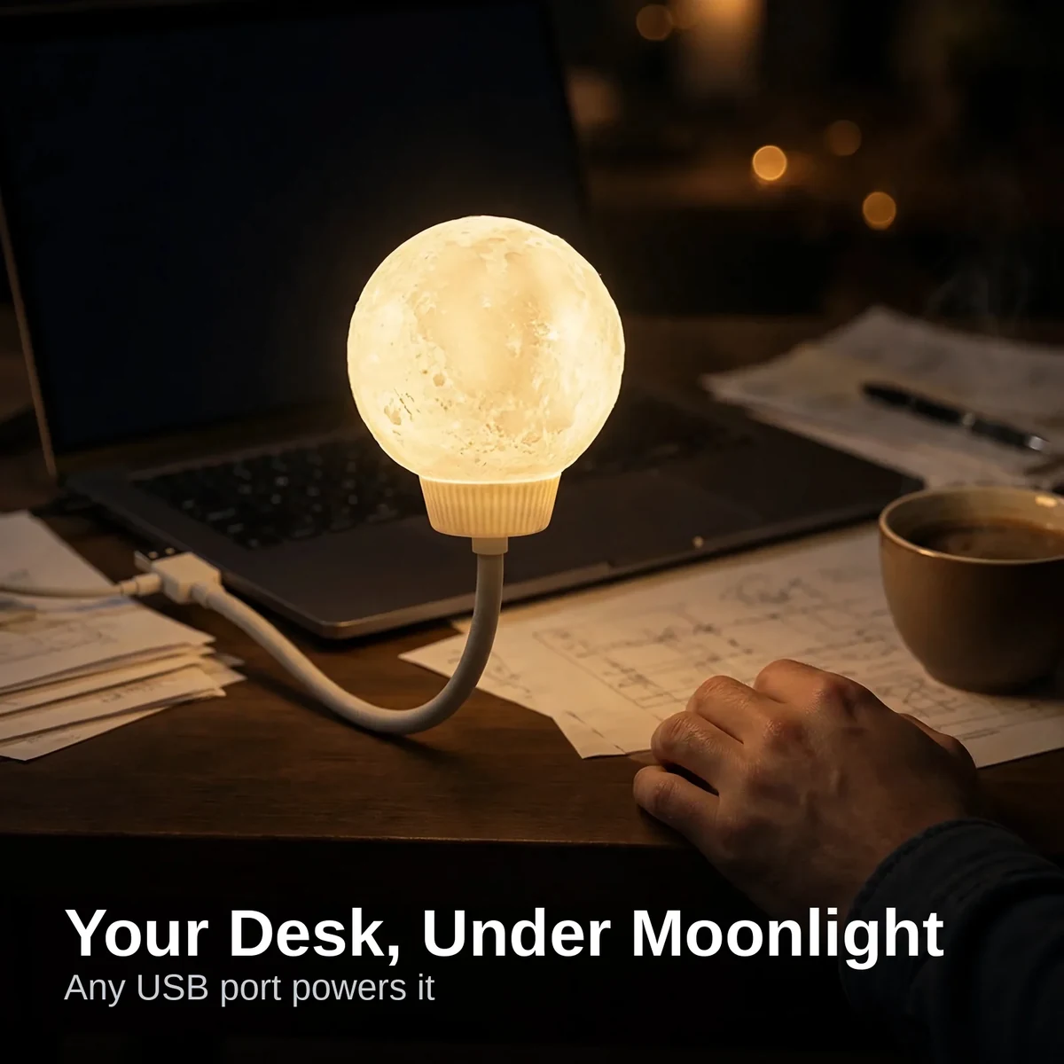 Moon light voice controlled LED lamp glowing on a study desk at night
