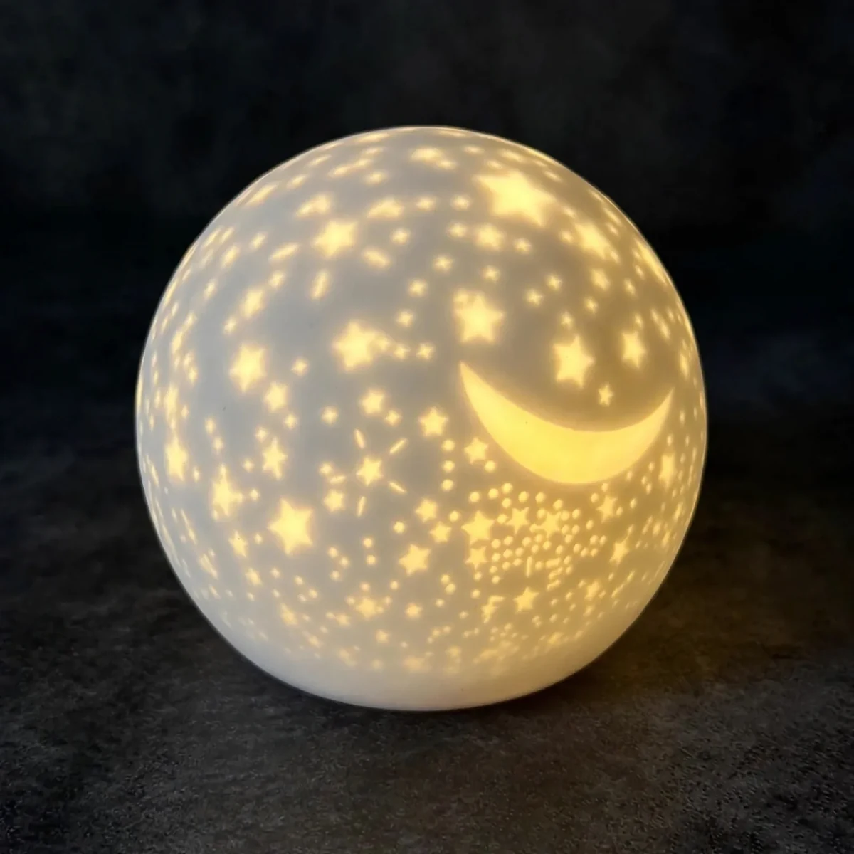 Silicone star night light front and angled gallery views glowing in the dark