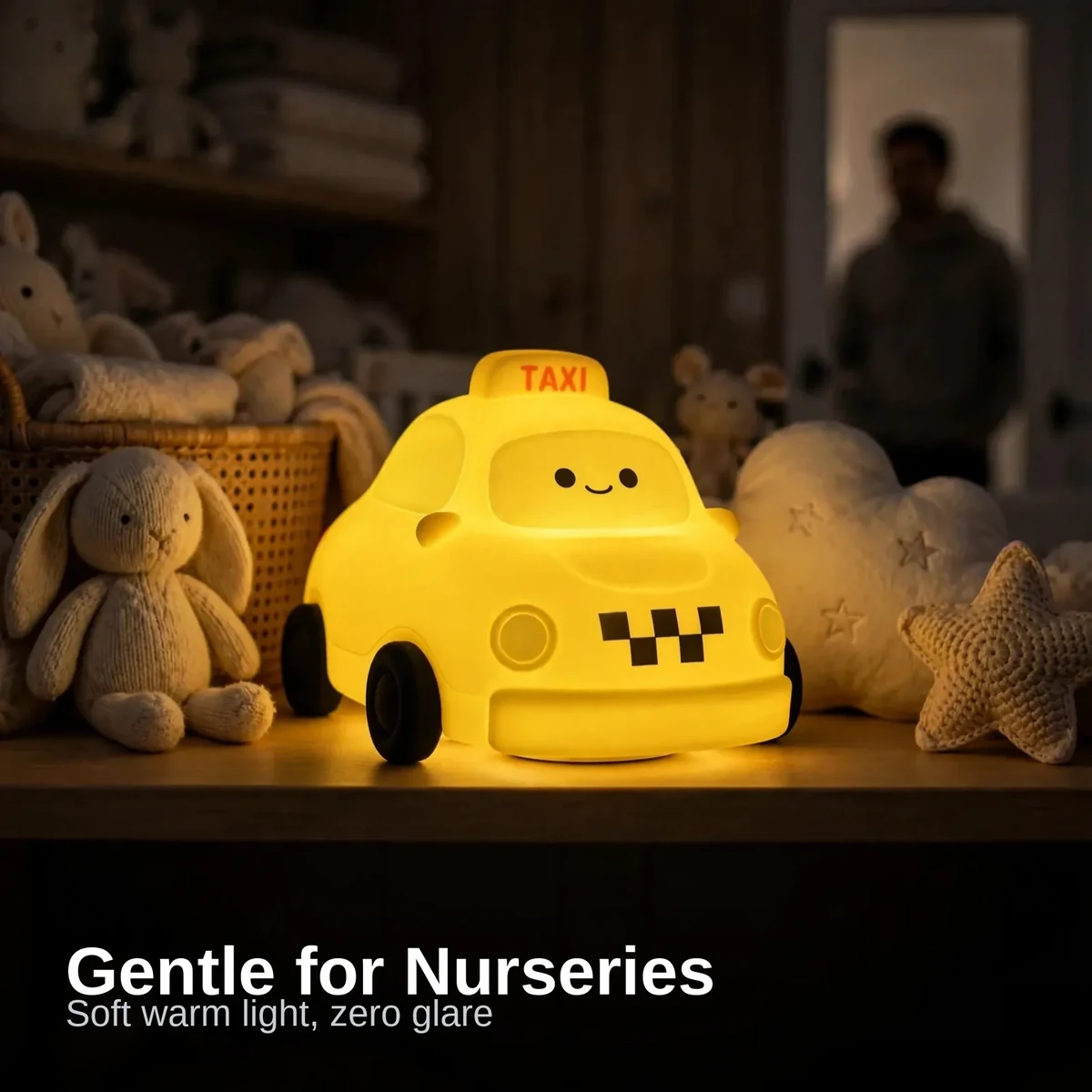 Taxi night lamp glowing on a nursery shelf among toys