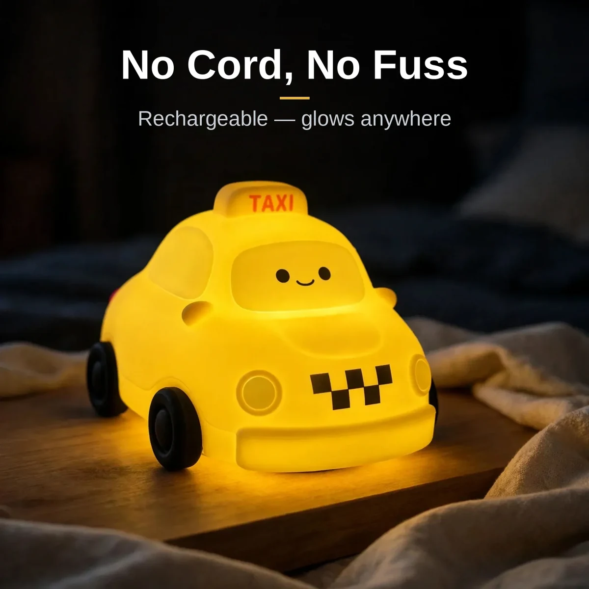 Taxi night lamp beside a gift box for birthdays and baby showers