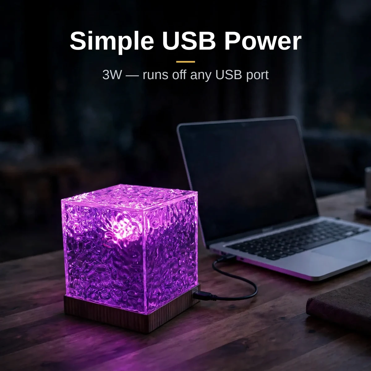 USB water pattern light powered by USB beside a laptop