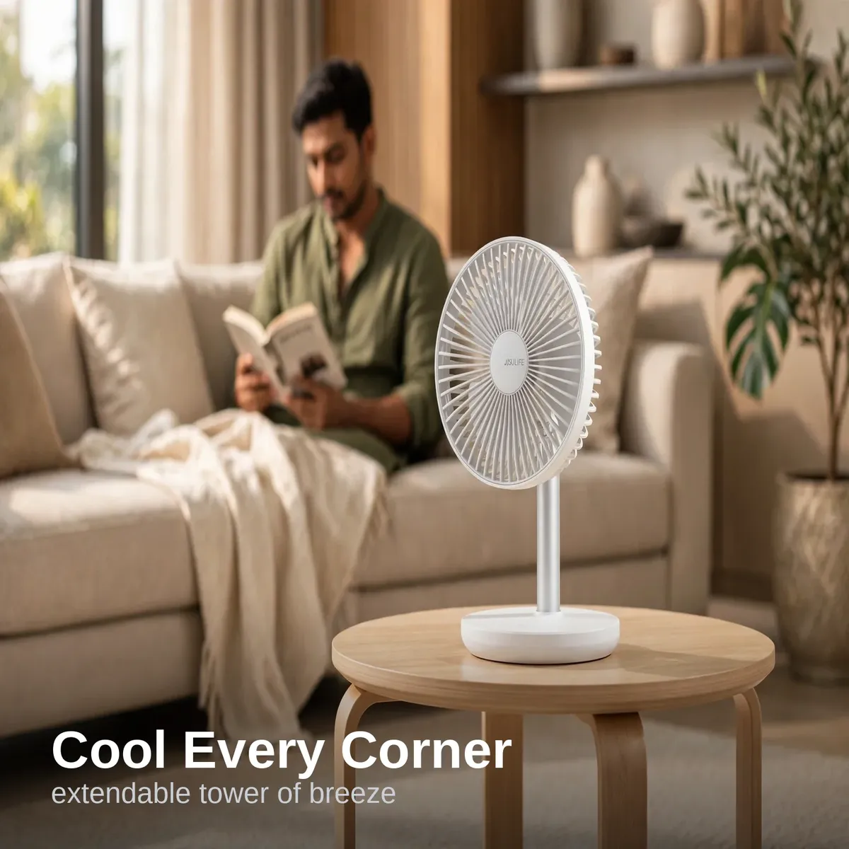 JISULIFE FA13P extendable desk fan cooling a living room