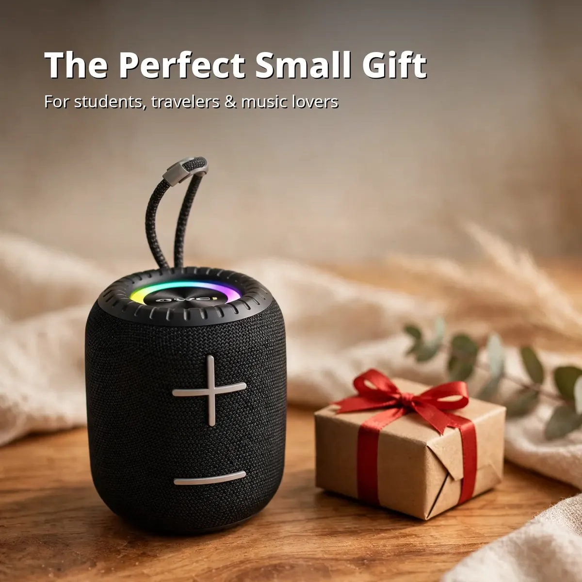 Awei Y526 speaker beside a gift box as a small gift idea