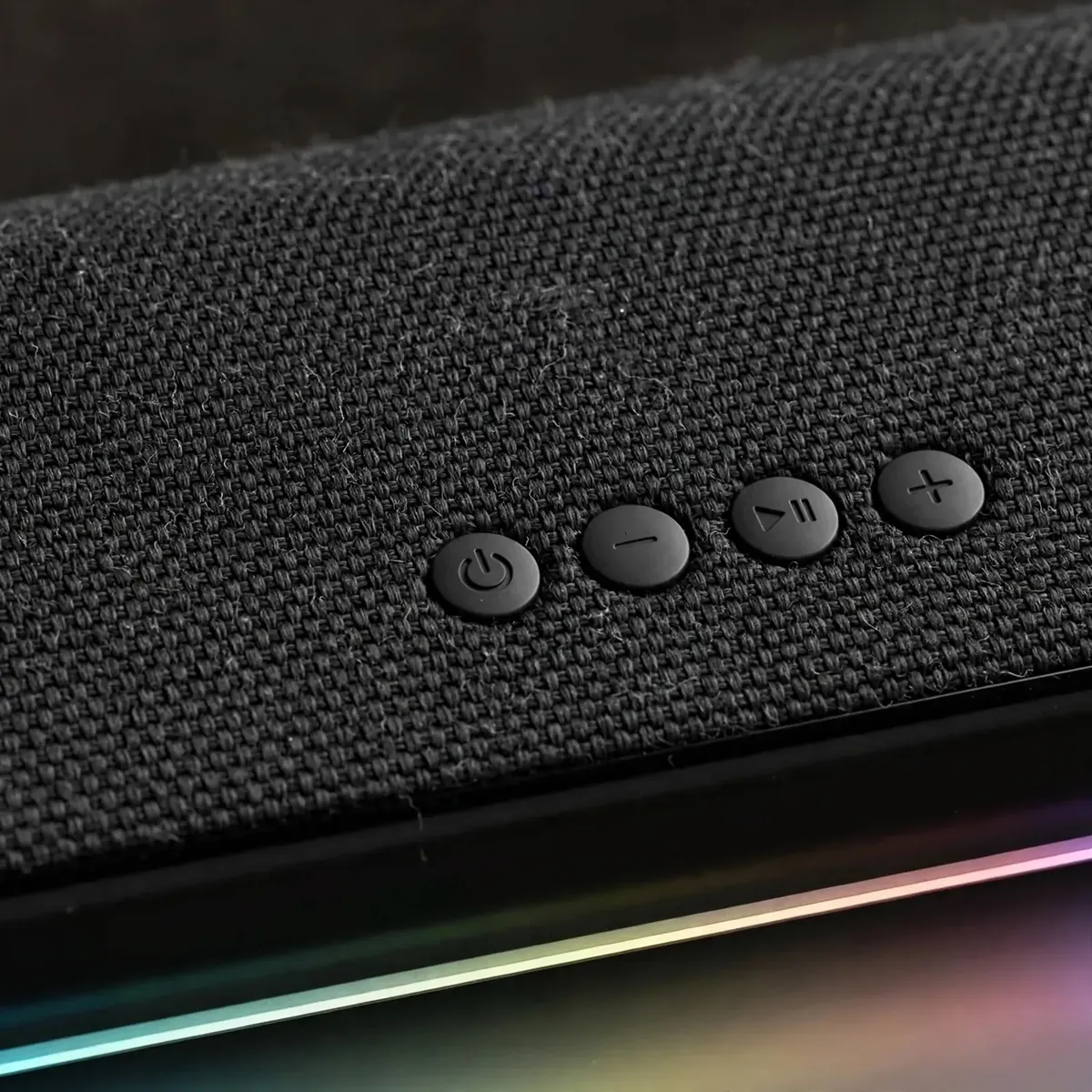 Awei KA51 top control buttons close-up showing power, volume and playback controls