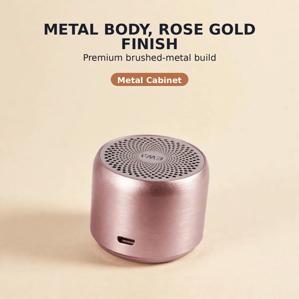 Ewa A106 Pro metal body card showing the rose gold brushed-metal speaker on a champagne studio backdrop