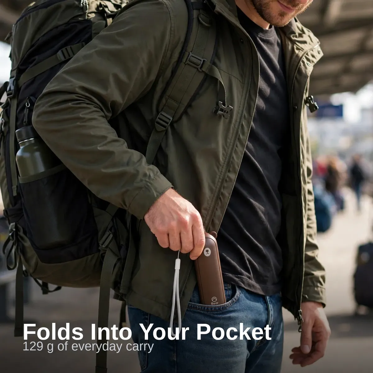 Man carrying the folded Jisulife F8 hand fan in his pocket while traveling