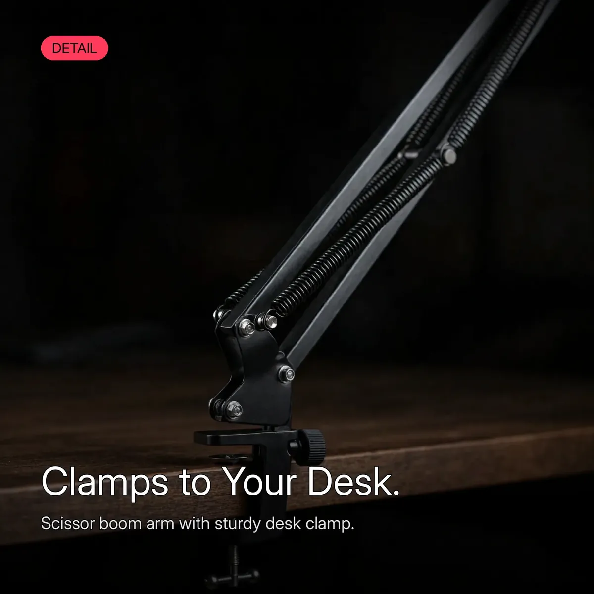 FIFINE AmpliGame A6T macro detail of the scissor boom arm's desk clamp and joint — Clamps to Your Desk. Scissor boom arm with sturdy desk clamp.