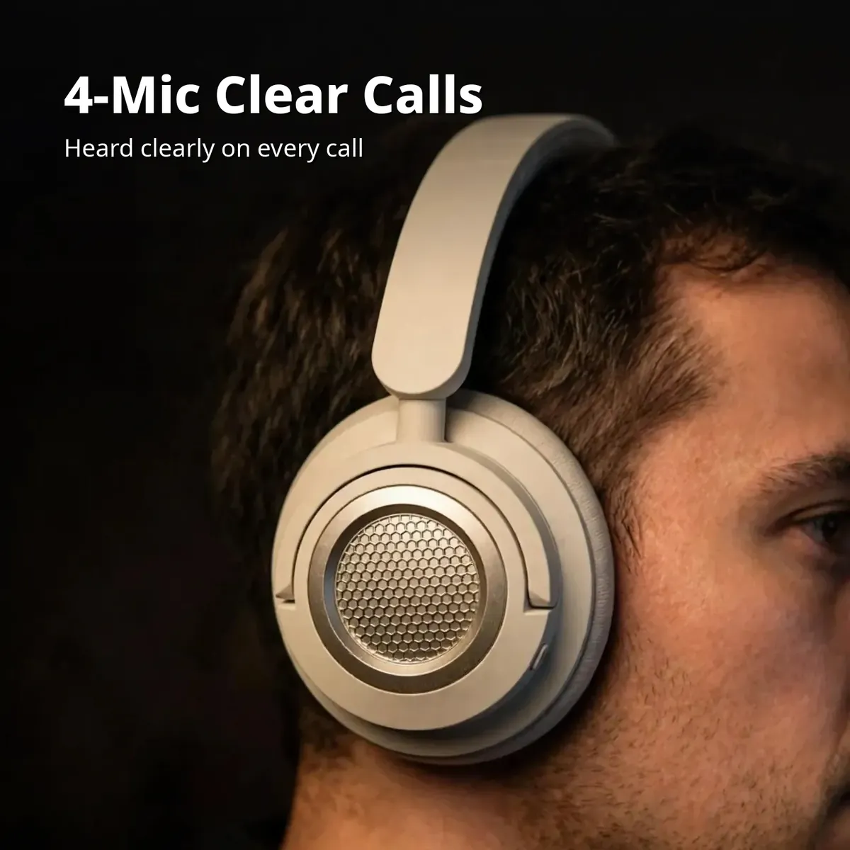 HiFuture Future Tour X close-up of a man wearing the beige headphones — 4-Mic Clear Calls. Heard clearly on every call.