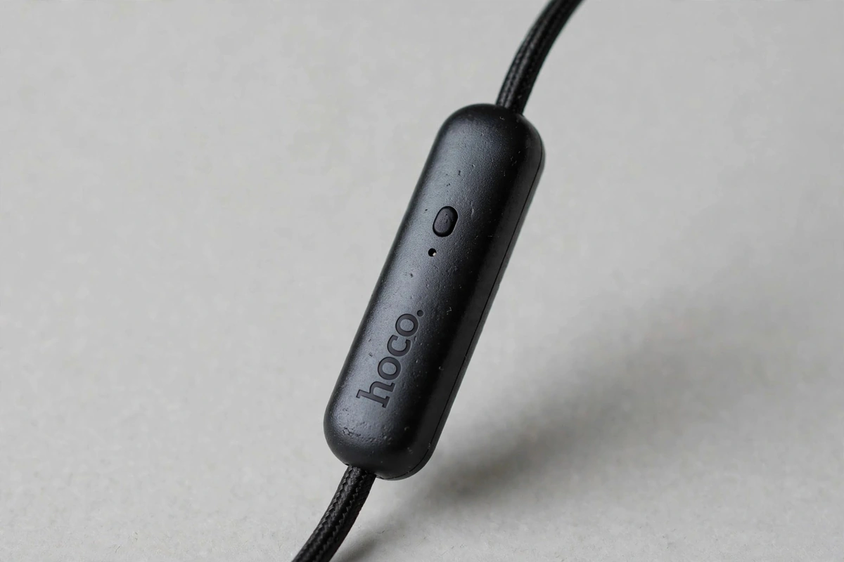 Close-up of the hoco-branded inline remote pod with single control button and microphone pinhole