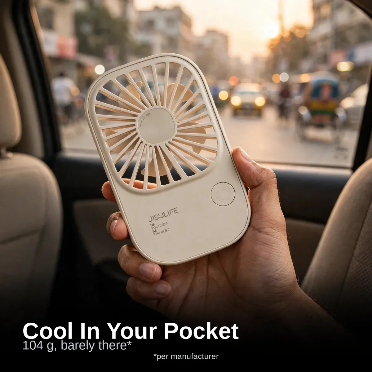 JISULIFE FA49 ultra-slim handheld fan held in hand during a Dhaka commute