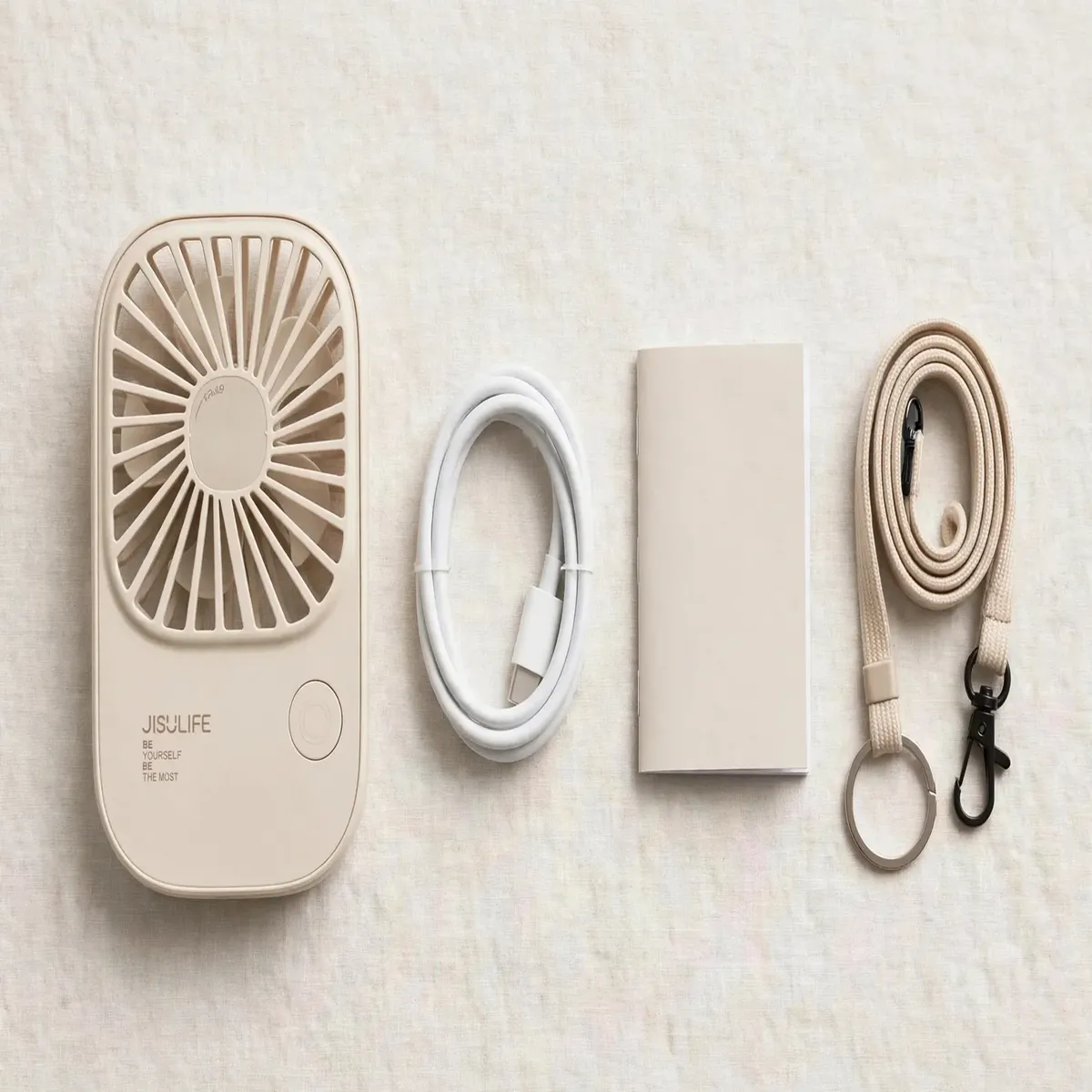 JISULIFE FA49 fan with USB-C cable, user manual and lanyard flat-lay