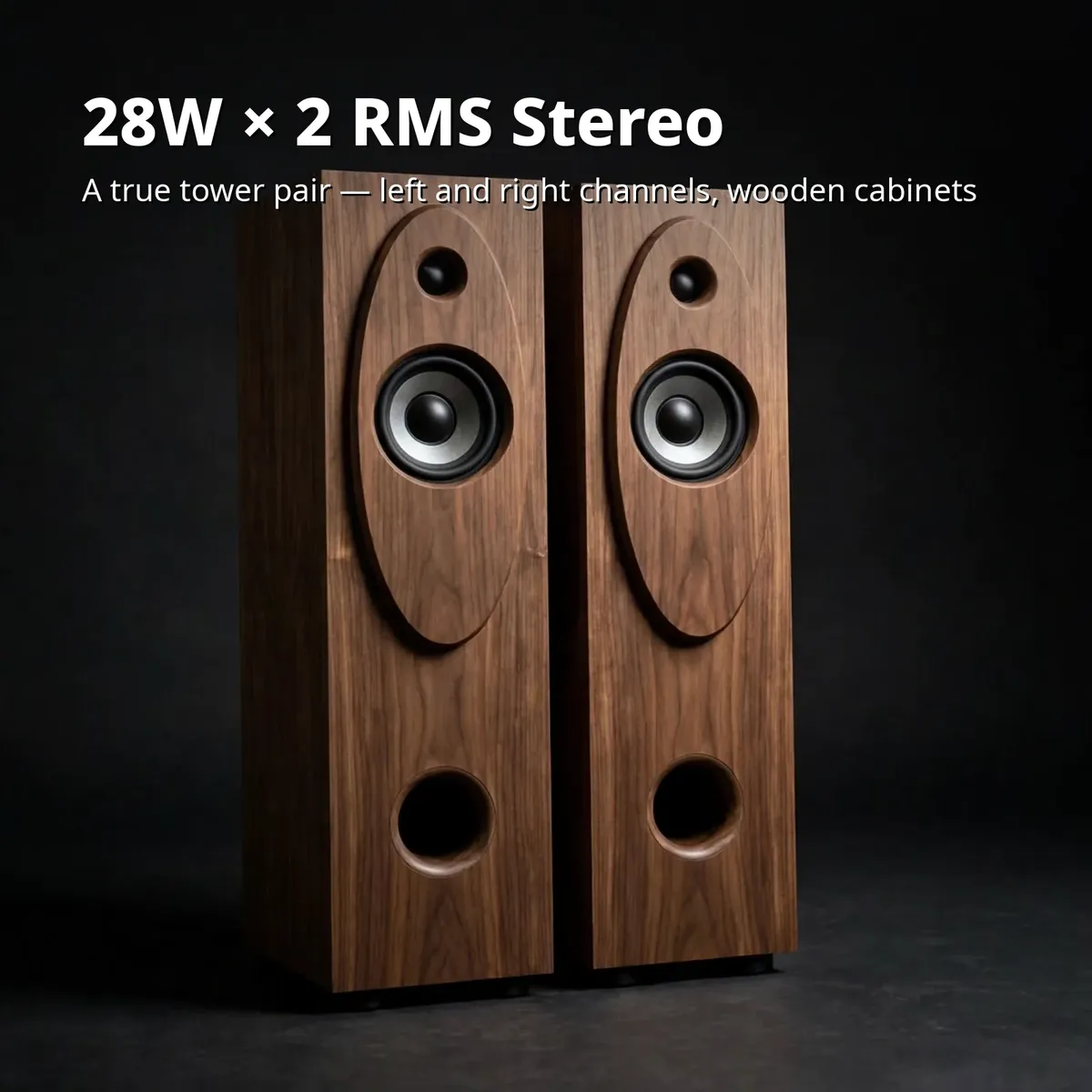 Kamasonic T30X power card showing 28W × 2 RMS stereo tower pair on dark studio backdrop
