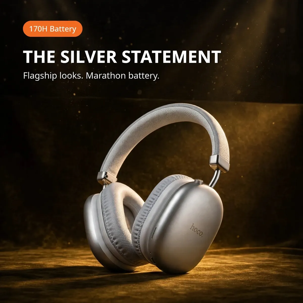 Hoco W35 Pro Max Silver promo hero under a spotlight on a dark-gold backdrop — THE SILVER STATEMENT. Flagship looks. Marathon battery. 170H Battery chip.