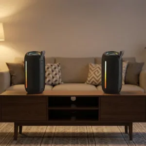 Two Awei Y788 speakers set up as a left and right stereo pair on a living-room console